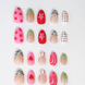 20 Piece Hand-Painted acrylic press-on nails with vibrant colors and designs including strawberries, stars, gingham, zebra print, and french tips. The nail colors are red, light green, light pink, zebra print, and silver details. The vibrant press ons are displayed on a white background